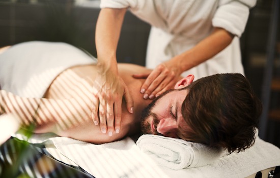 Man having back massage at the health spa