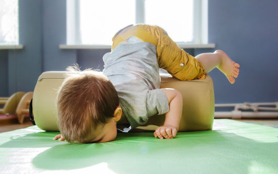 the child fell face down on the mat during a session with a roller