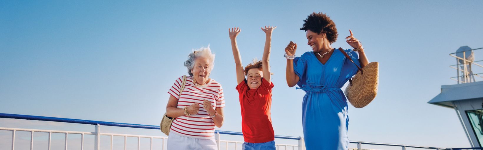 Three generations enjoying time together on board a Stena Line ferry under clear blue skies