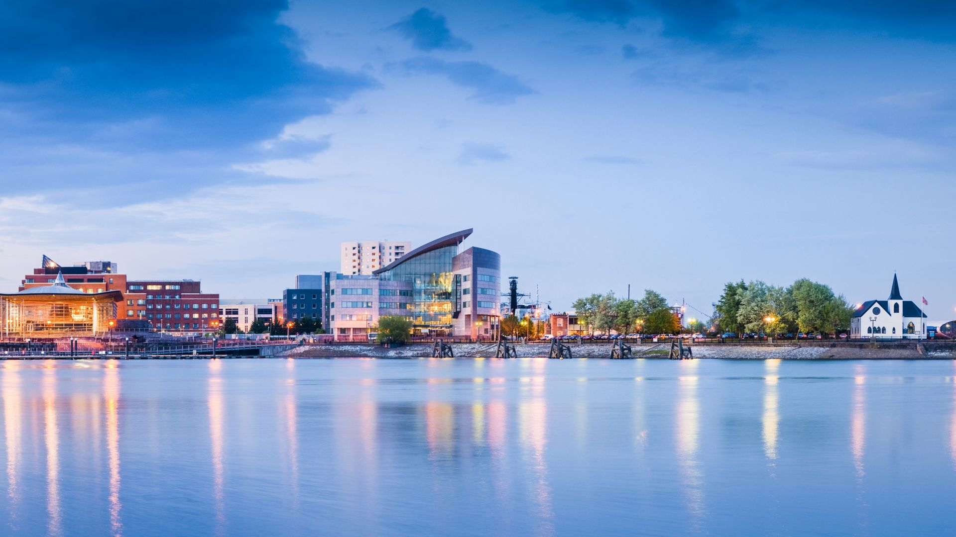 Pretty night time illuminations of the stunning Cardiff Bay, many sights visible including the Pierhead building (1897) and National Assembly for Wales.