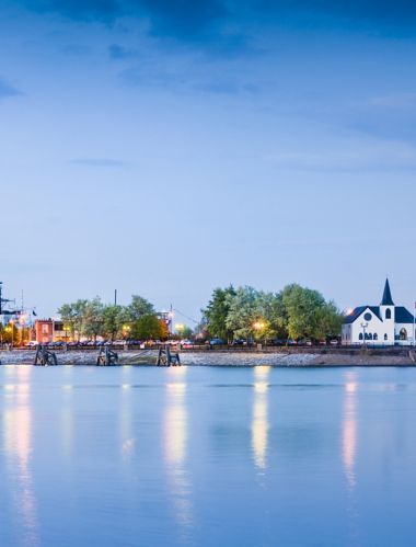 Pretty night time illuminations of the stunning Cardiff Bay, many sights visible including the Pierhead building (1897) and National Assembly for Wales.