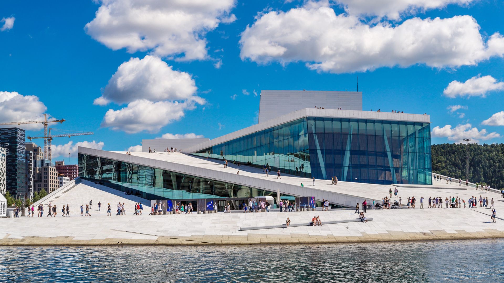 OSLO, NORWAY - JULY 29: The Oslo Opera House is the home of The Norwegian National Opera and Ballet, and the national opera theatre in Norway in Oslo, Norway on July 29, 2014