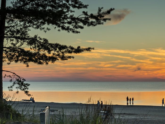 Colorful sunset at sandy beach at Jurmala - the famous resort in the Baltic region, Latvia