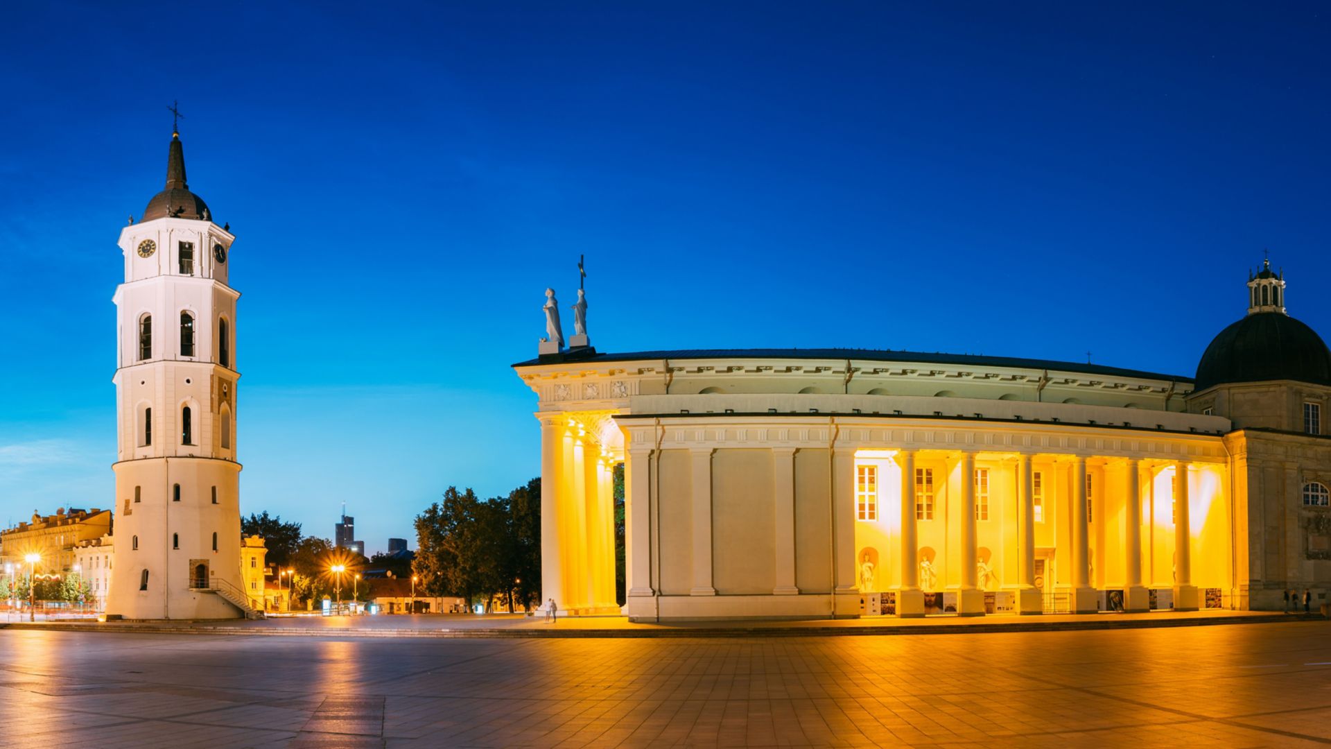 Vilnius, Lithuania, Eastern Europe. Evening Night Panorama Of Bell Tower Belfry, Cathedral Basilica Of St. Stanislaus And St. Vladislav And Palace Of The Grand Dukes Of Lithuania In Twilight. UNESCO