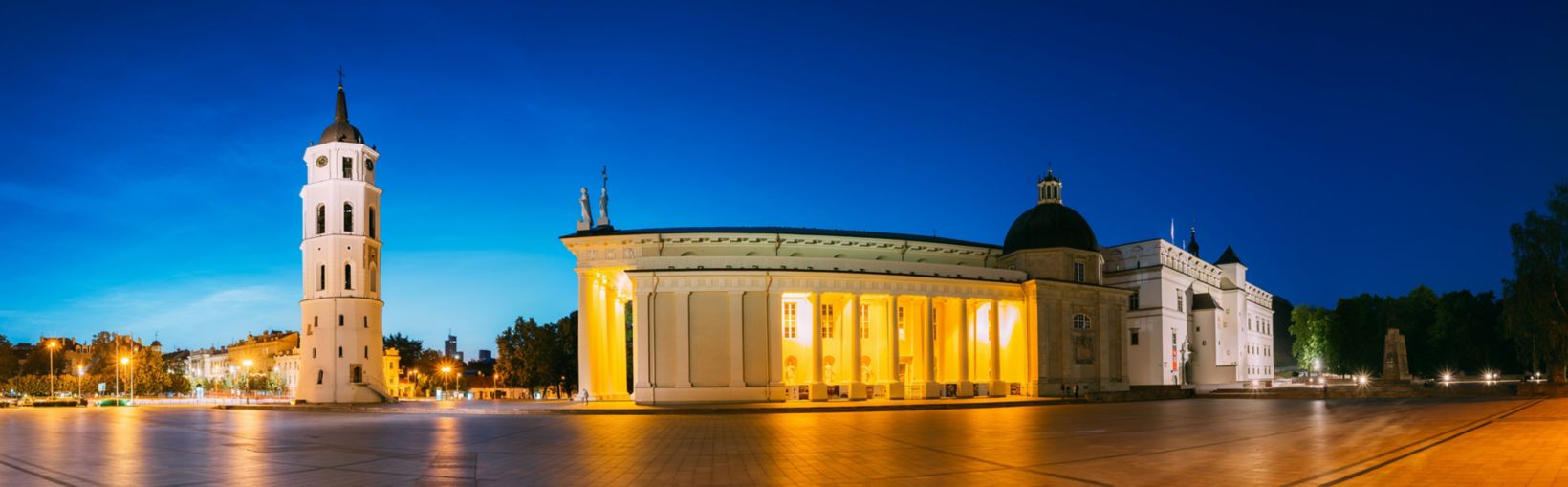 Vilnius, Lithuania, Eastern Europe. Evening Night Panorama Of Bell Tower Belfry, Cathedral Basilica Of St. Stanislaus And St. Vladislav And Palace Of The Grand Dukes Of Lithuania In Twilight. UNESCO