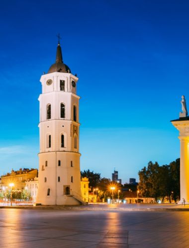 Vilnius, Lithuania, Eastern Europe. Evening Night Panorama Of Bell Tower Belfry, Cathedral Basilica Of St. Stanislaus And St. Vladislav And Palace Of The Grand Dukes Of Lithuania In Twilight. UNESCO