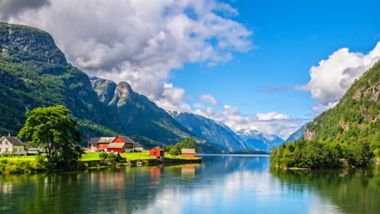 Amazing nature view with fjord and mountains. Beautiful reflection. Location: Scandinavian Mountains, Norway. Artistic picture. Beauty world. The feeling of complete freedom