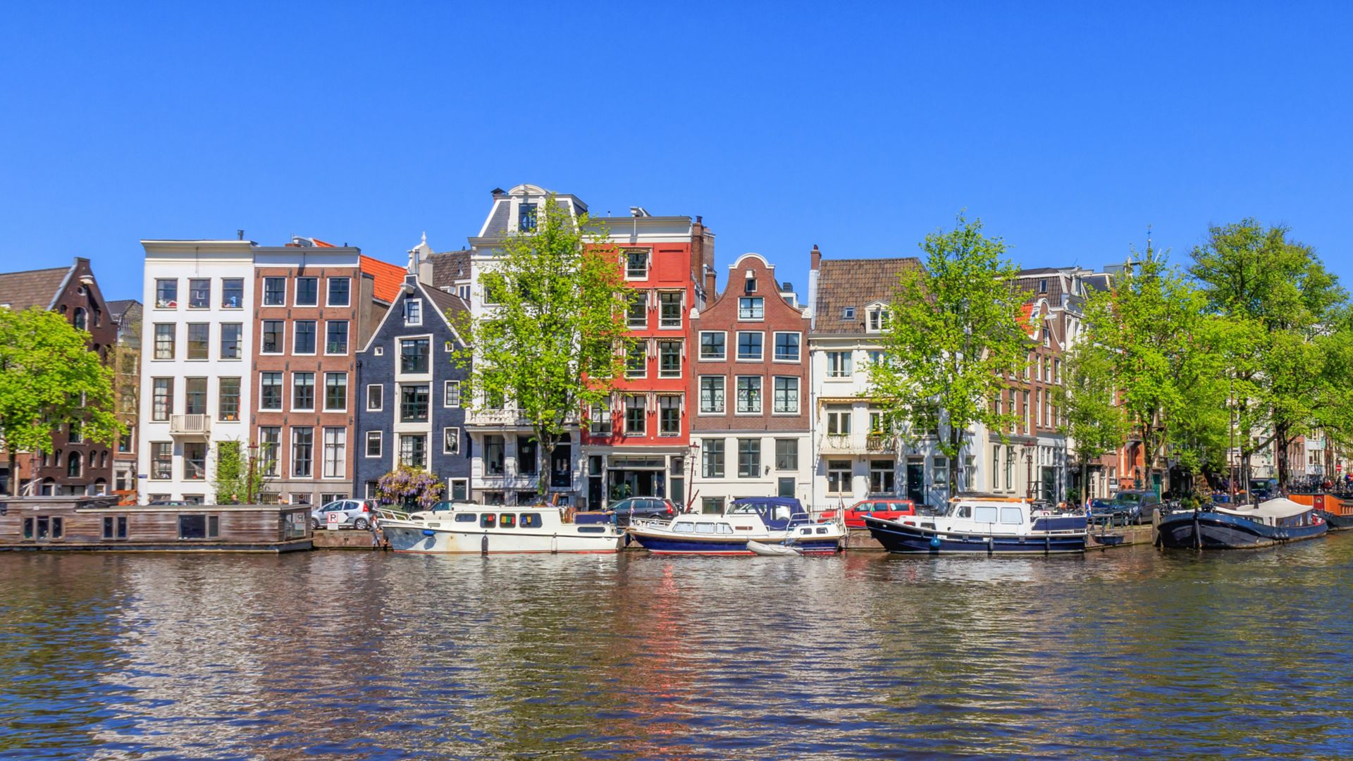 Panorama View Of Houses Near Canals In Amsterdam