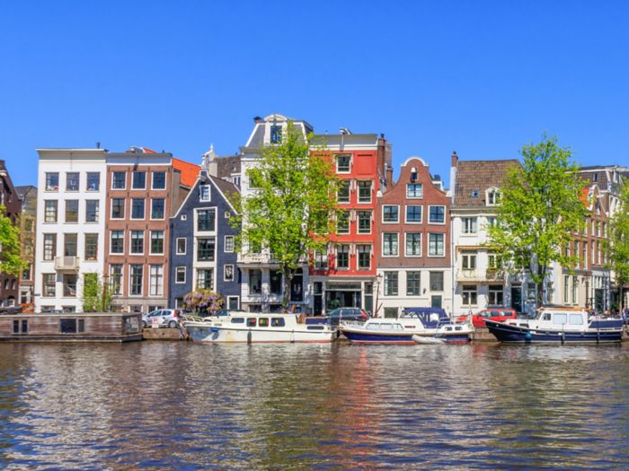 Panorama View Of Houses Near Canals In Amsterdam