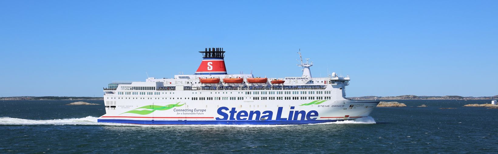 View of starboard side of Stena Danica at sea on a cloudless day