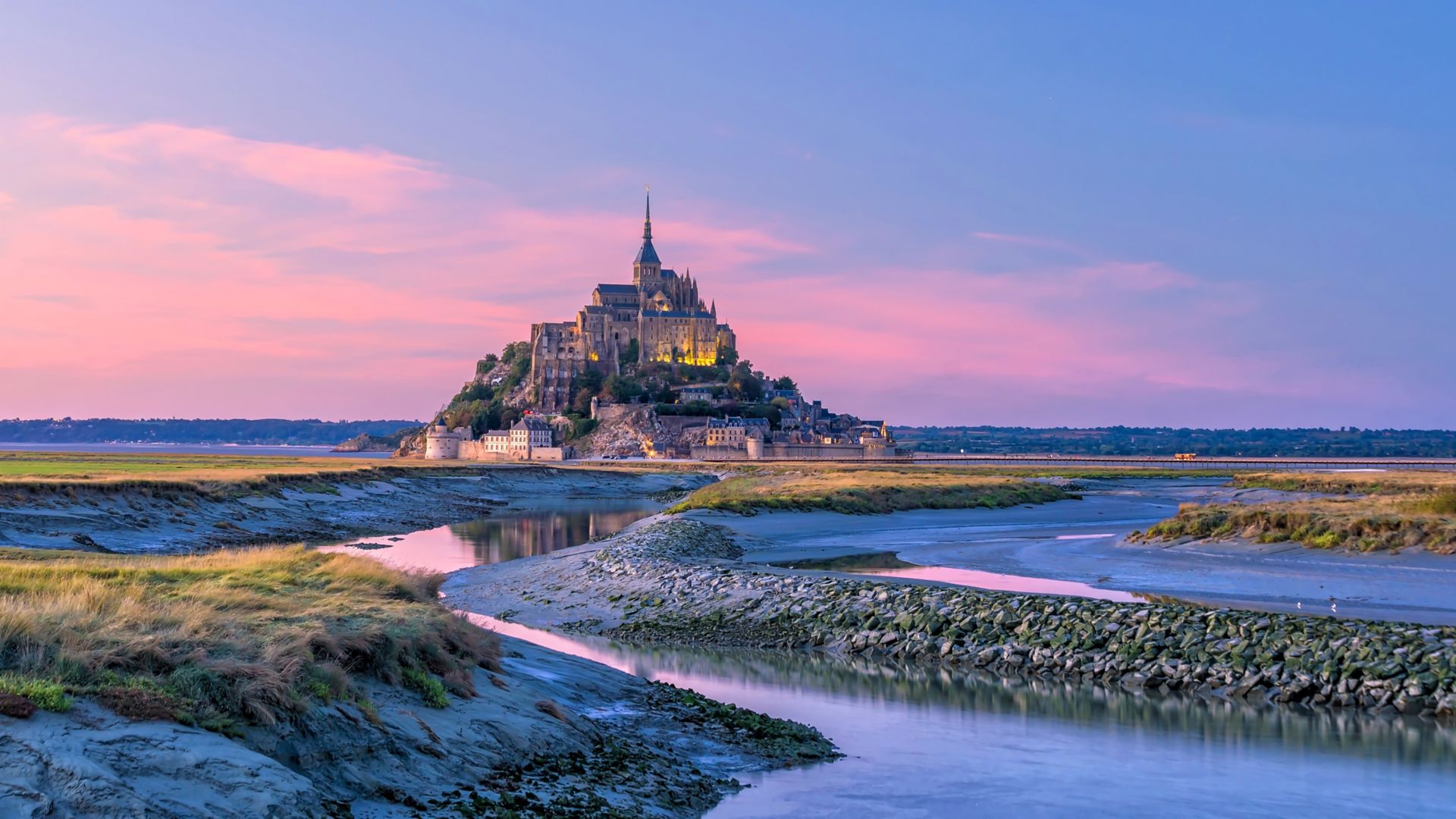 Mont Saint-Michel at sunset twilight in Normandy, northern France