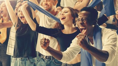 Group of happy fans cheering for their team