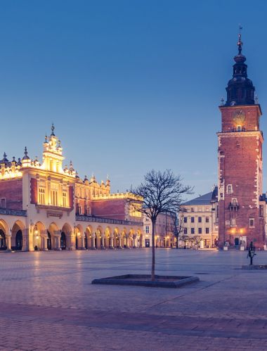 Krakow, Poland, main square night panorama with Cloth Hall and St Mary's church