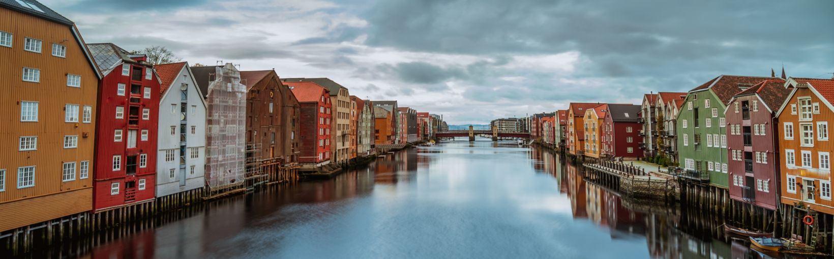 Panorama of colourful buildings alongside canal in Trondheim