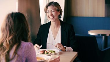 Women enjoying a meal in the restaurant onboard