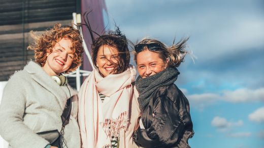 Three smiling women onboard