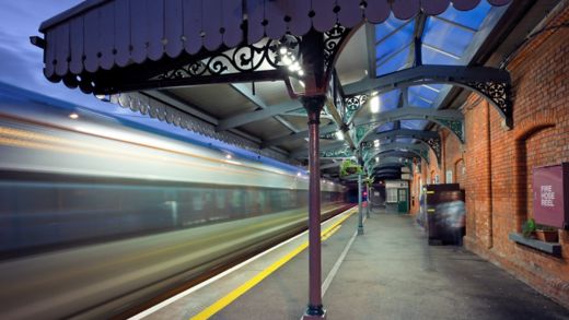 High-speed  intercity train in motion and  Athenry station at night, Ireland