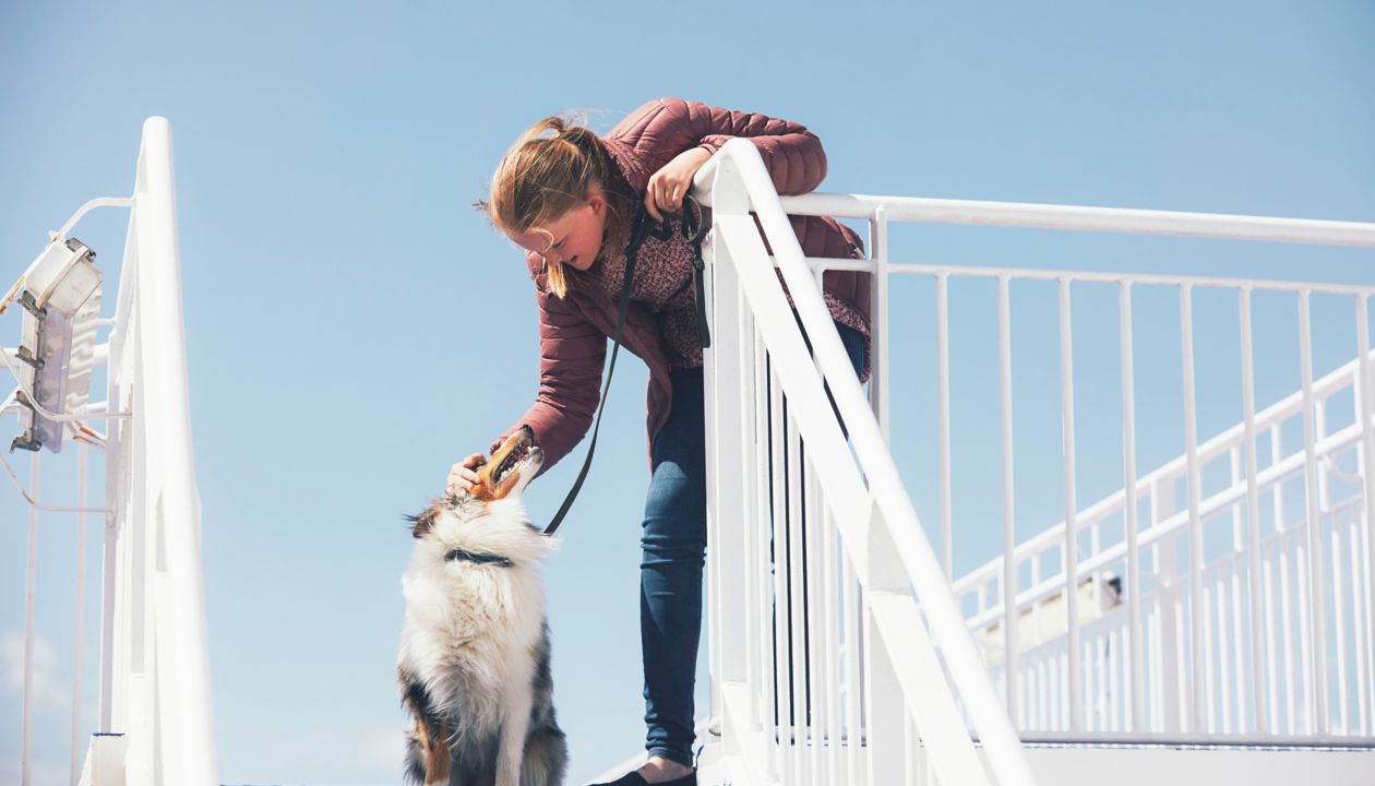 Girl with dog onboard