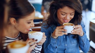 Women drinking coffee onboard