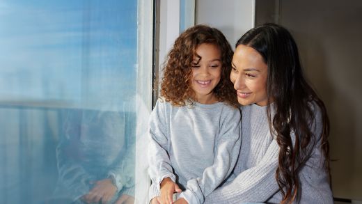 Mother and daughter onboard in the window