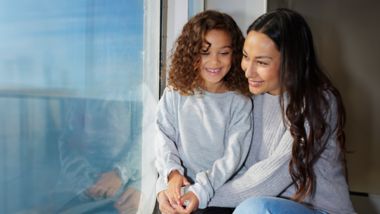 Mother and daughter onboard in the window