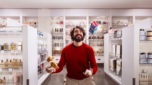 Man juggling at shopping onboard