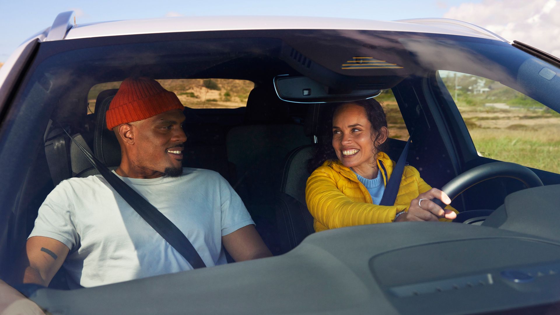 Couple travelling by car during autumn