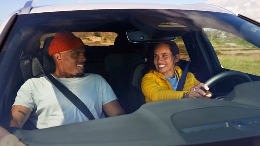 Couple travelling by car during autumn