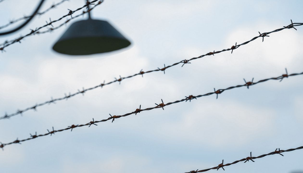 Barbed wire to demarcate the concentration camp and an old lamp