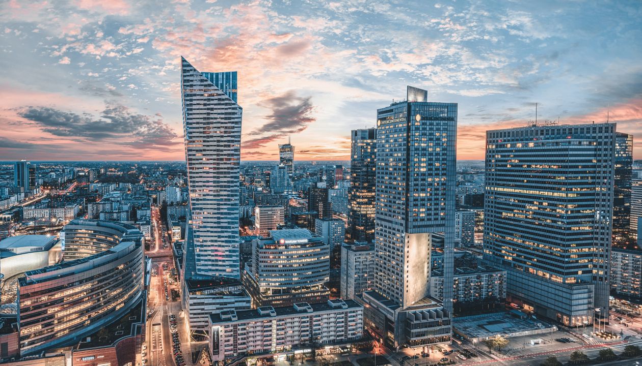 Warsaw city with modern skyscraper at sunset