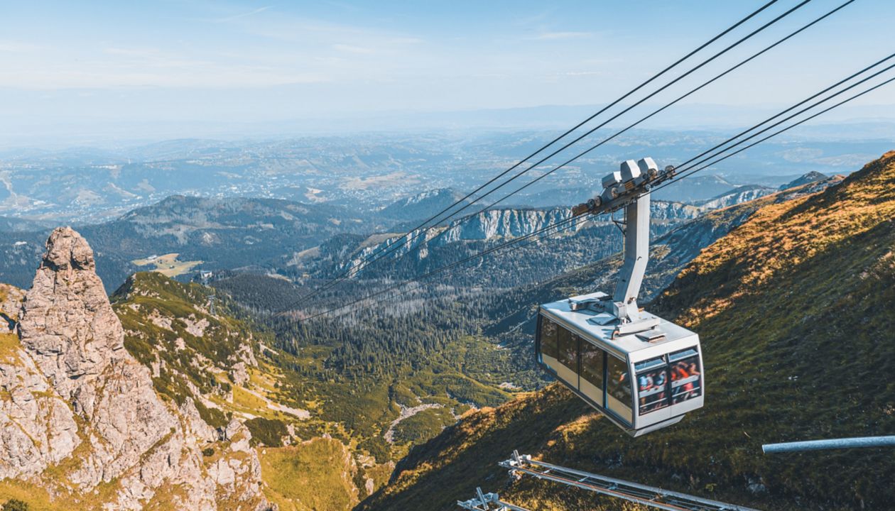 cable car on the ropes, going to Mount Kasprowy Wierch, Poland. Beautiful view of the valley