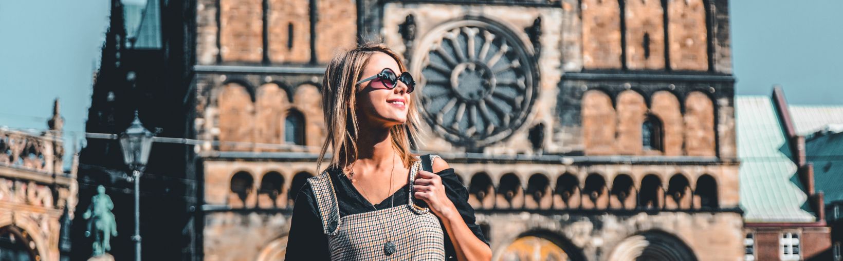 Young girl on central square of Bremen near Catherdral. Germany 