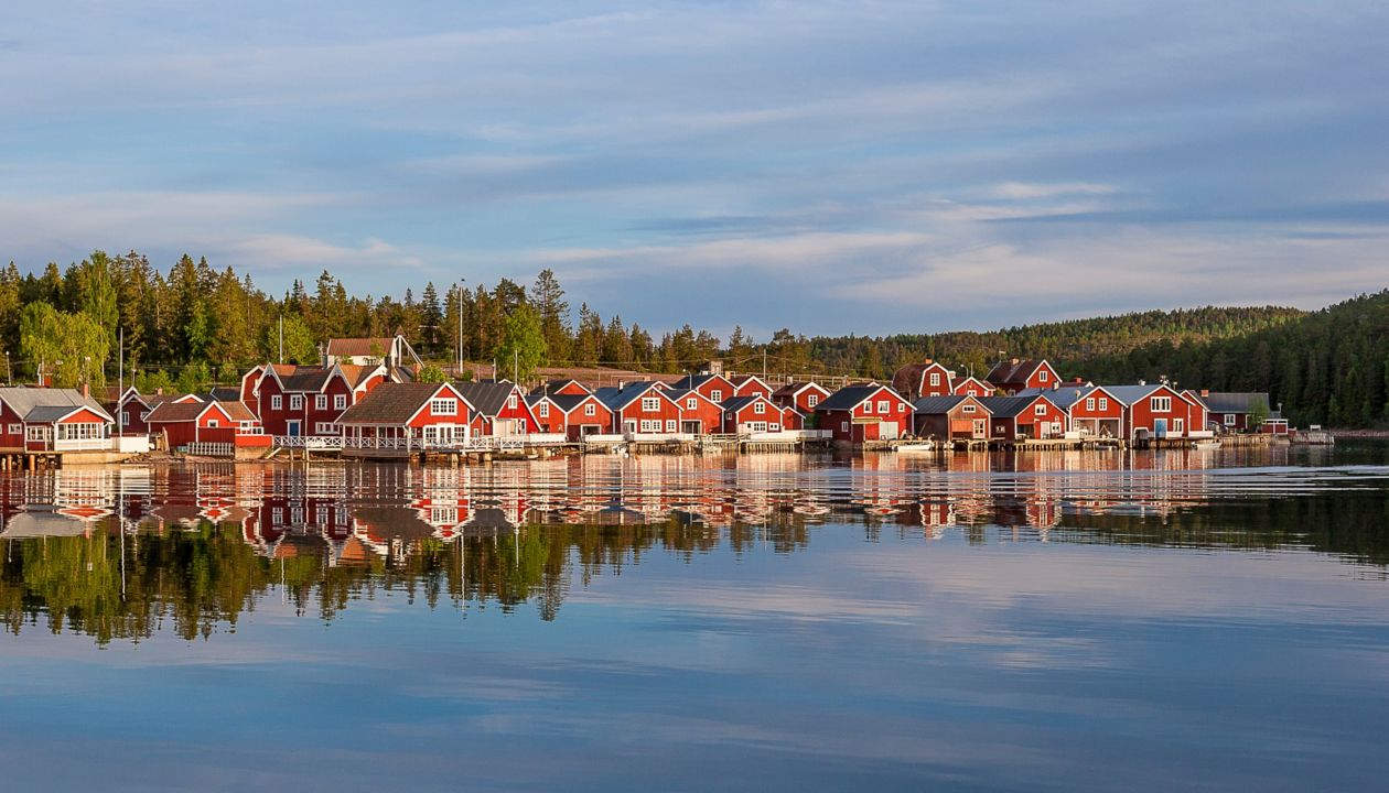 Red houses at sunset in the fishing village of Norfaellsviken, Höga Kusten, Sweden