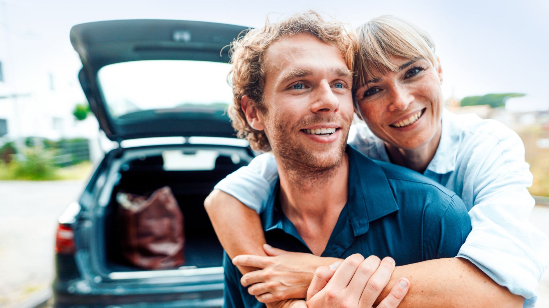 Smiling woman embracing man on vacation