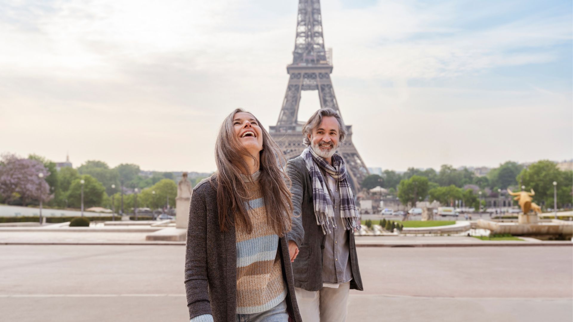 Happy mature couple in front of Eiffel Tower, Paris, France