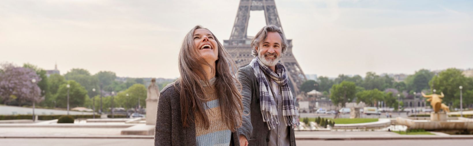 Happy mature couple in front of Eiffel Tower, Paris, France