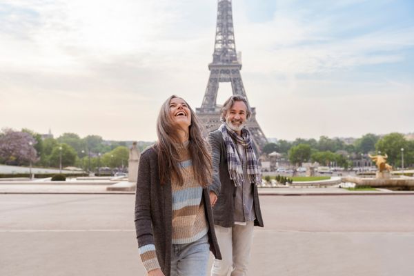 Happy mature couple in front of Eiffel Tower, Paris, France