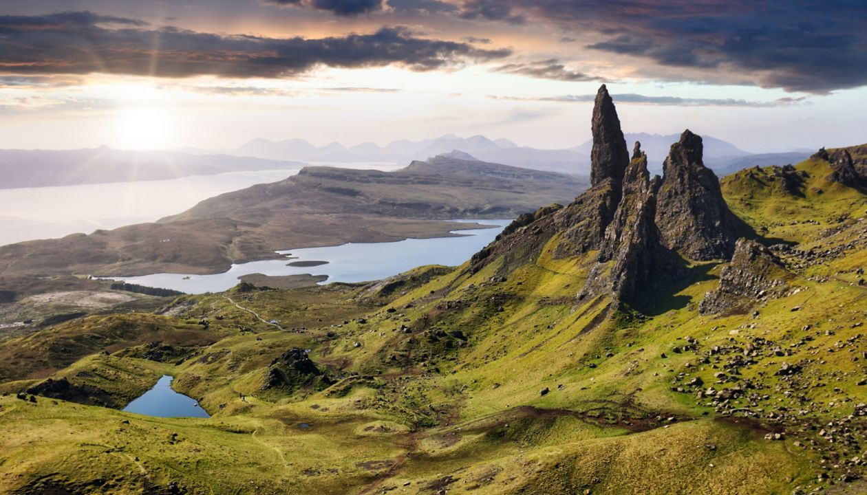 Mountain panorama with sun in Scotland, Isle of Skye - Old man of storr