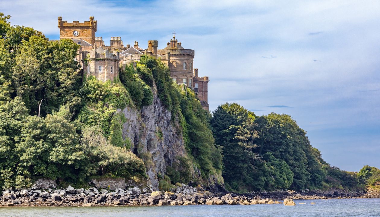 Culzean Castle in Scotland perched on a mountainside near the water