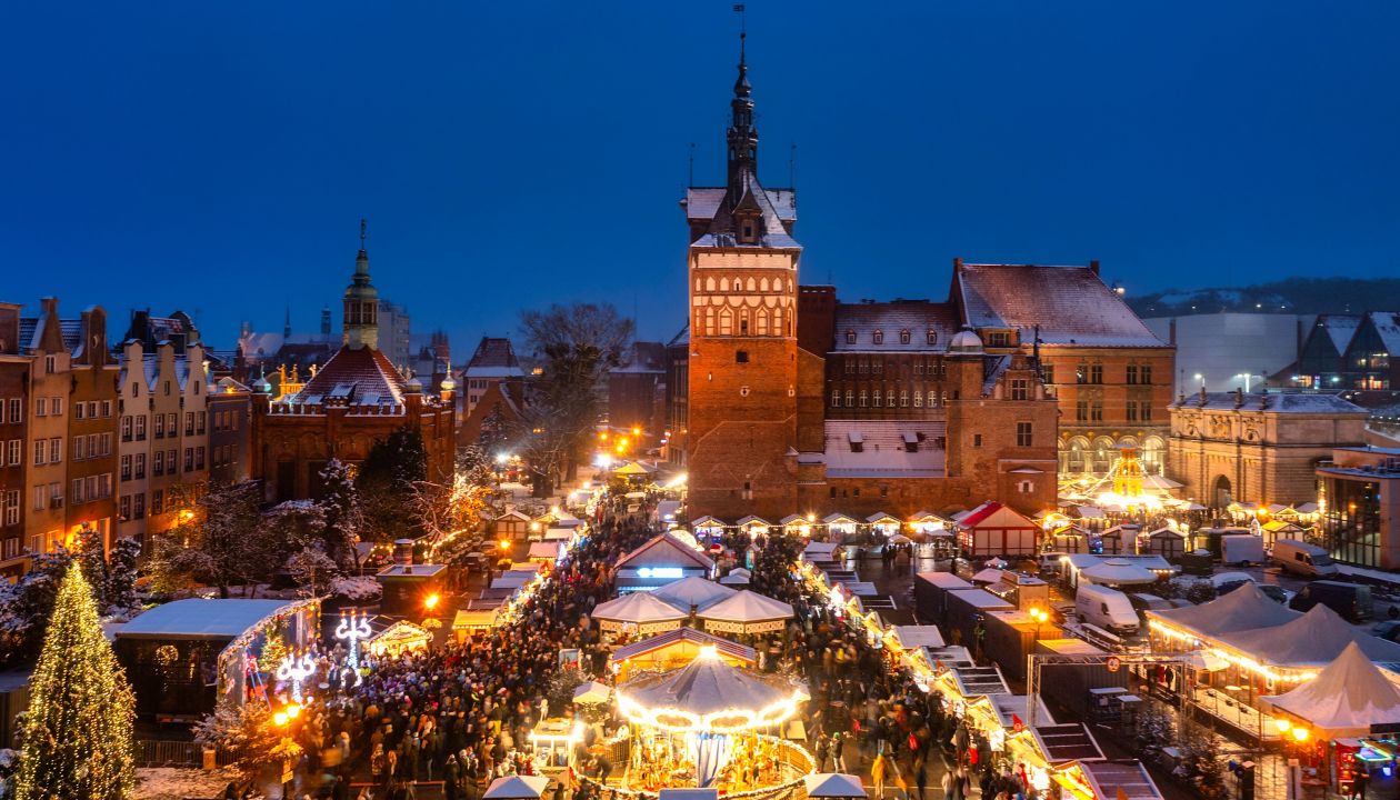 Beautifully lit Christmas fair in the Main City of Gdansk at dusk. Poland