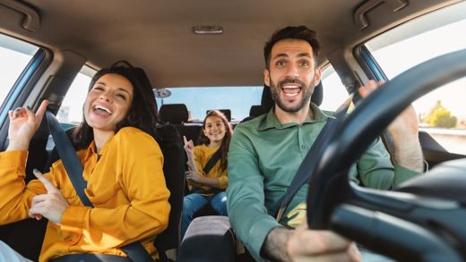 Family enjoying a happy car journey, inspiring relaxed travel to your ferry departure