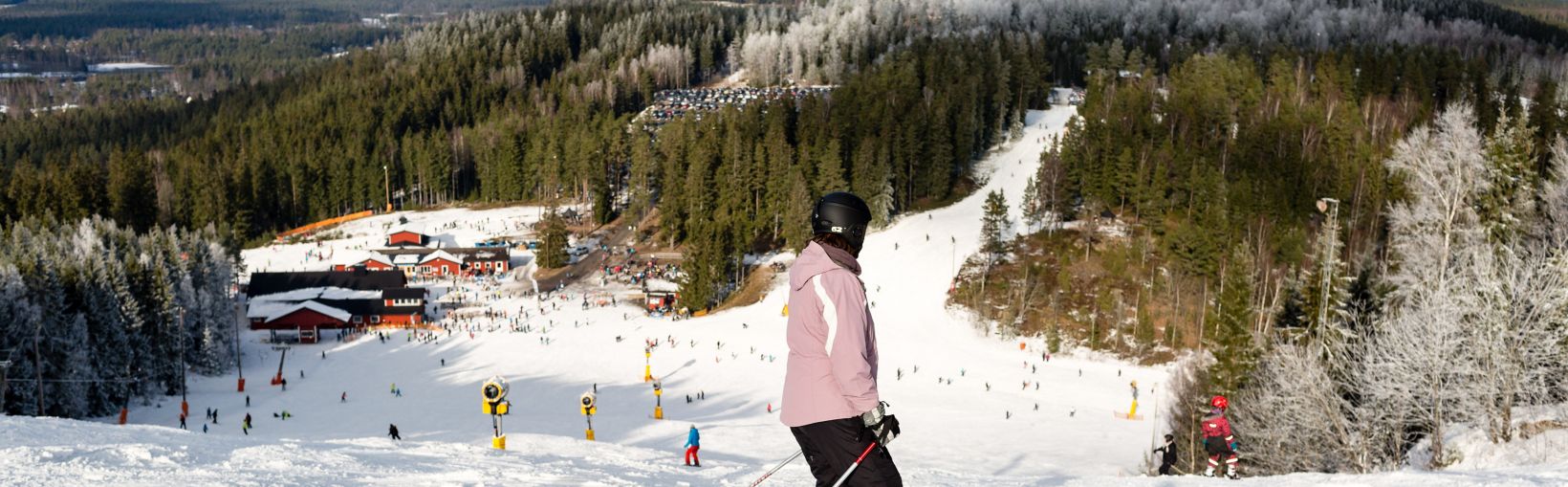 ISABERG, SWEDEN - FEBRUARY 17, 2016: The small ski resort Isaberg in Sweden welcomes skiers on a sunny day during the main skiing season in February.