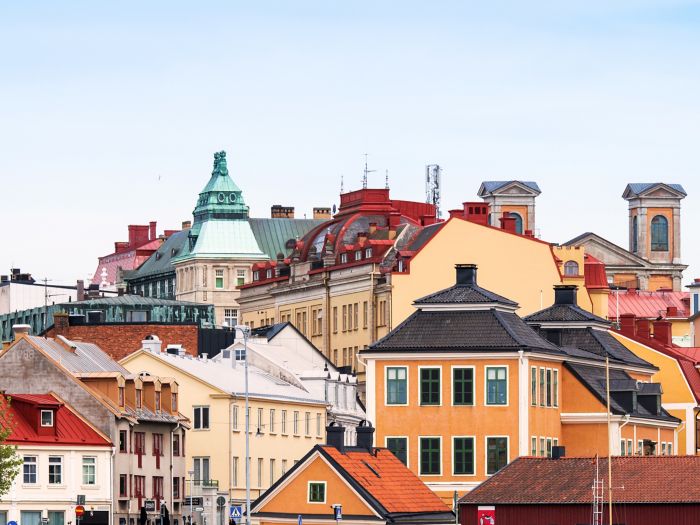 Colourful historic buildings in central Karlskrona with ornate rooftops and classical architecture.