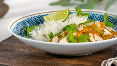 Chicken korma with rice, coriander and lime