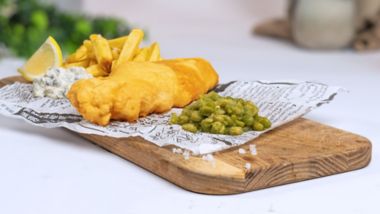Fish and chips with mushy peas, tartare sauce and lemon