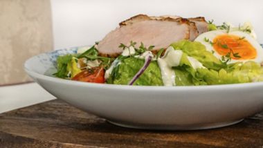 Grilled chicken salad with soft-boiled egg and greens