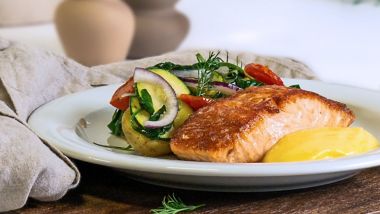 Seared salmon with warm potato salad and creamy sauce
