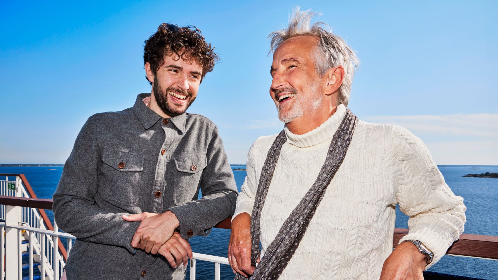 Friends on deck onboard a ferry