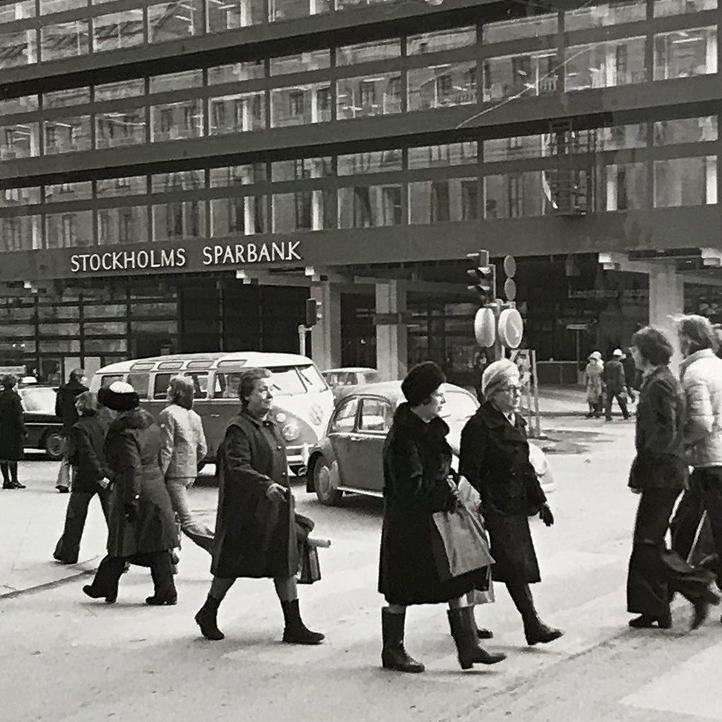 Black and white old picture of people walking on the streets of Stockholm