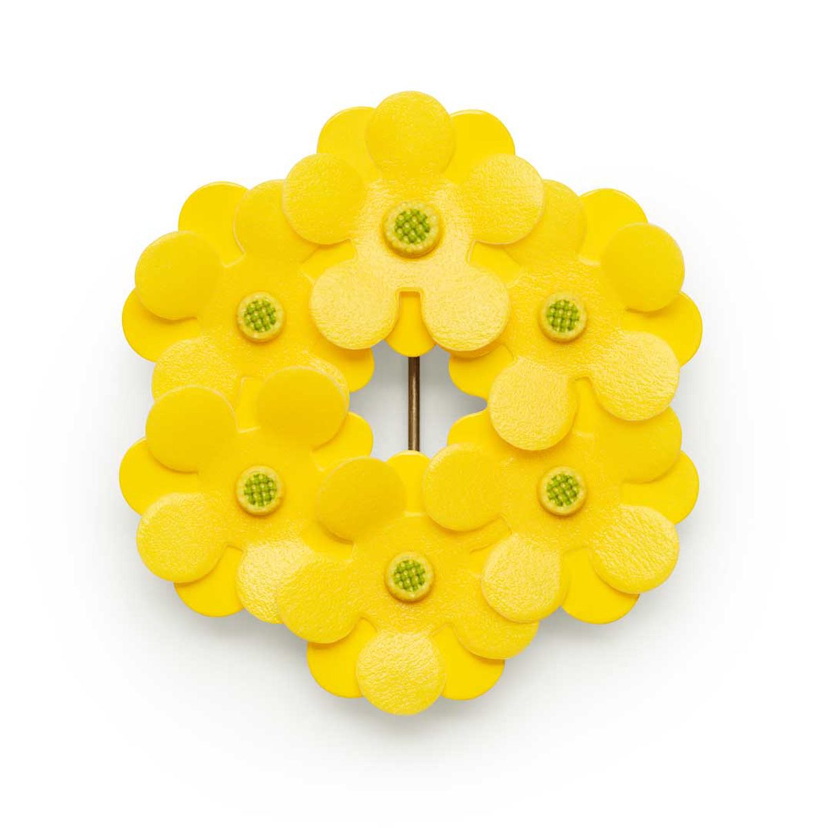 Årets majblomma är klargul med en grön mitt